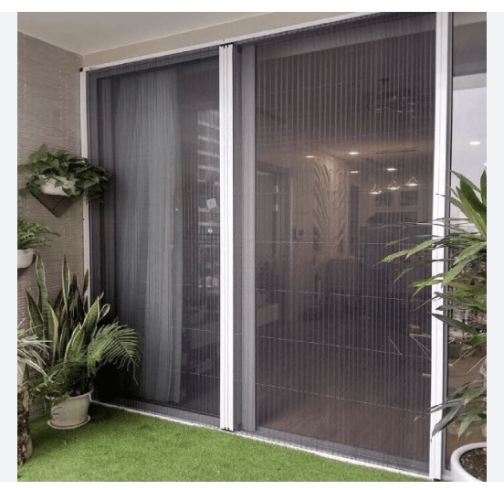 Pleated sliding mosquito mesh fitted across a balcony opening