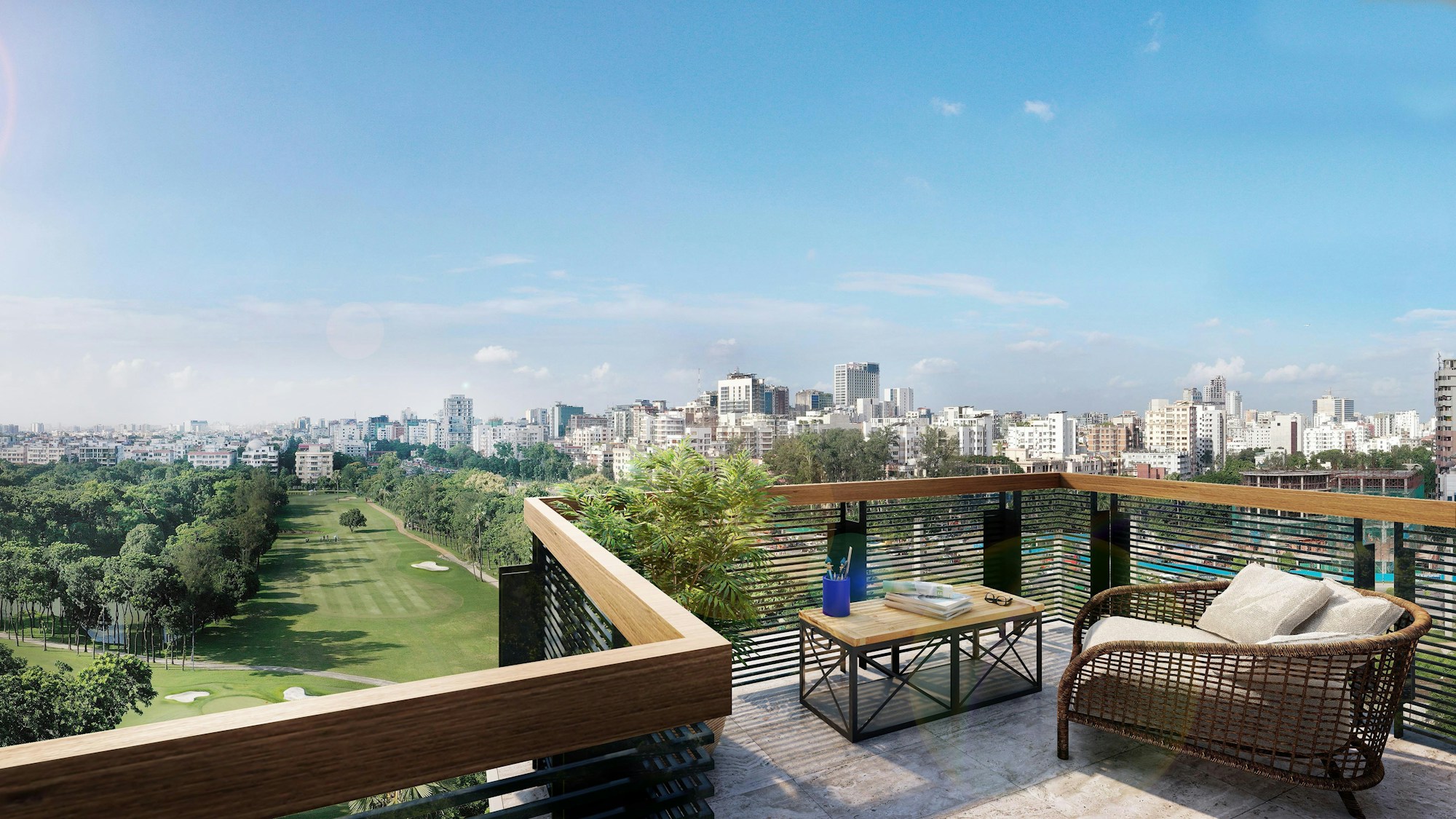 A premium balcony lounge with a city view and greenery